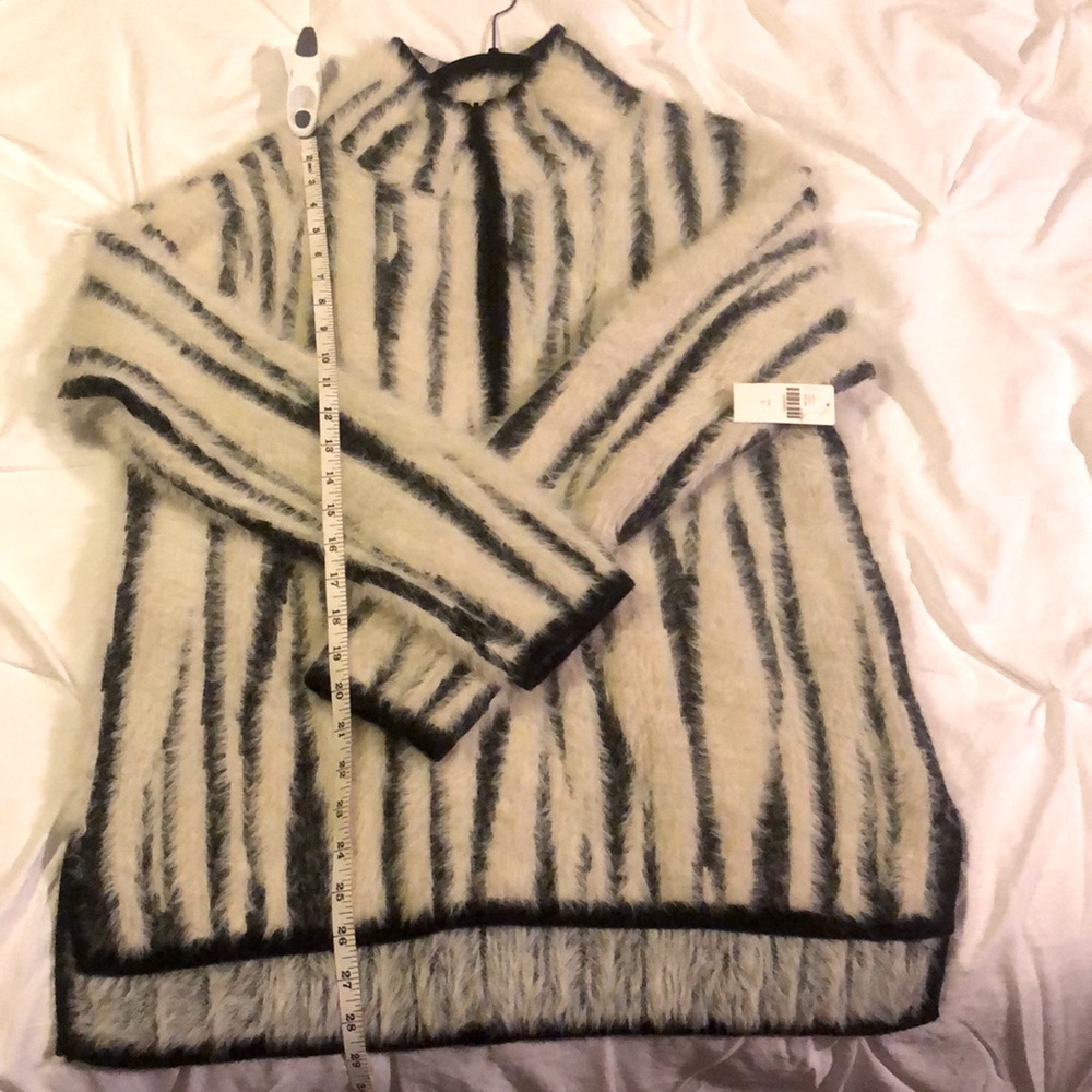 Anthropology zebra stripes fleece pullover.